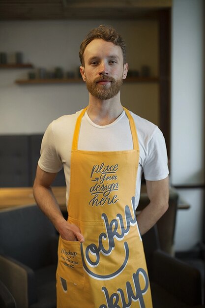 Medium shot man wearing apron at work