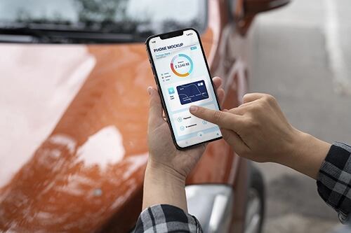 Mock-up design on smartphone touchscreen held by person